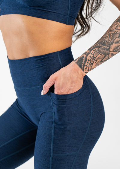 Close Up Side View Hand in Pocket Wearing Dream Leggings With Pockets | Deep Blue