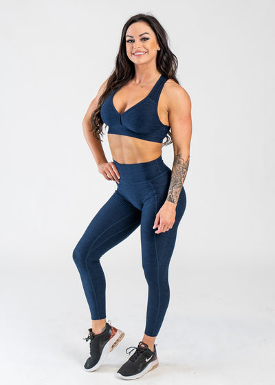 Full Body 3/4 Front Facing View With One Hand on Hip Wearing Dream Leggings With Pockets | Deep Blue