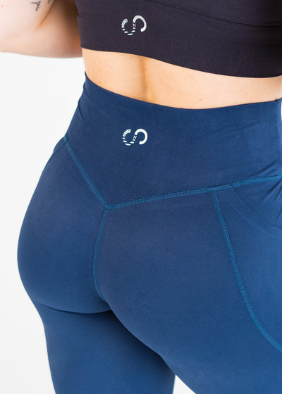 3/4 Back View Close Up Chest to Upper Thigh Wearing Empowered Double Brushed Leggings - Navy Blue